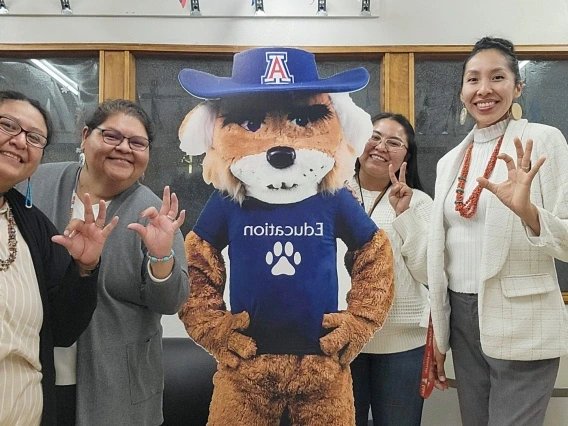 wilbur flexing with 4 faculty members
