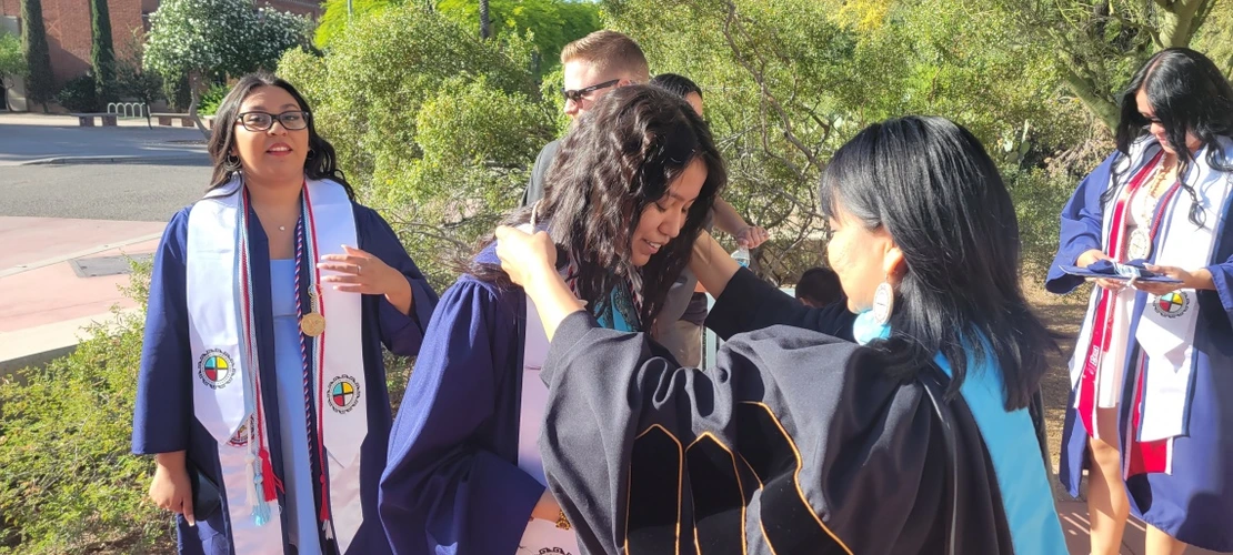 itep students in their graduation garb