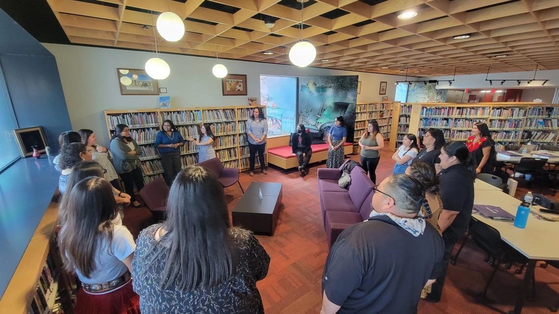 teacher and group of students in a circle