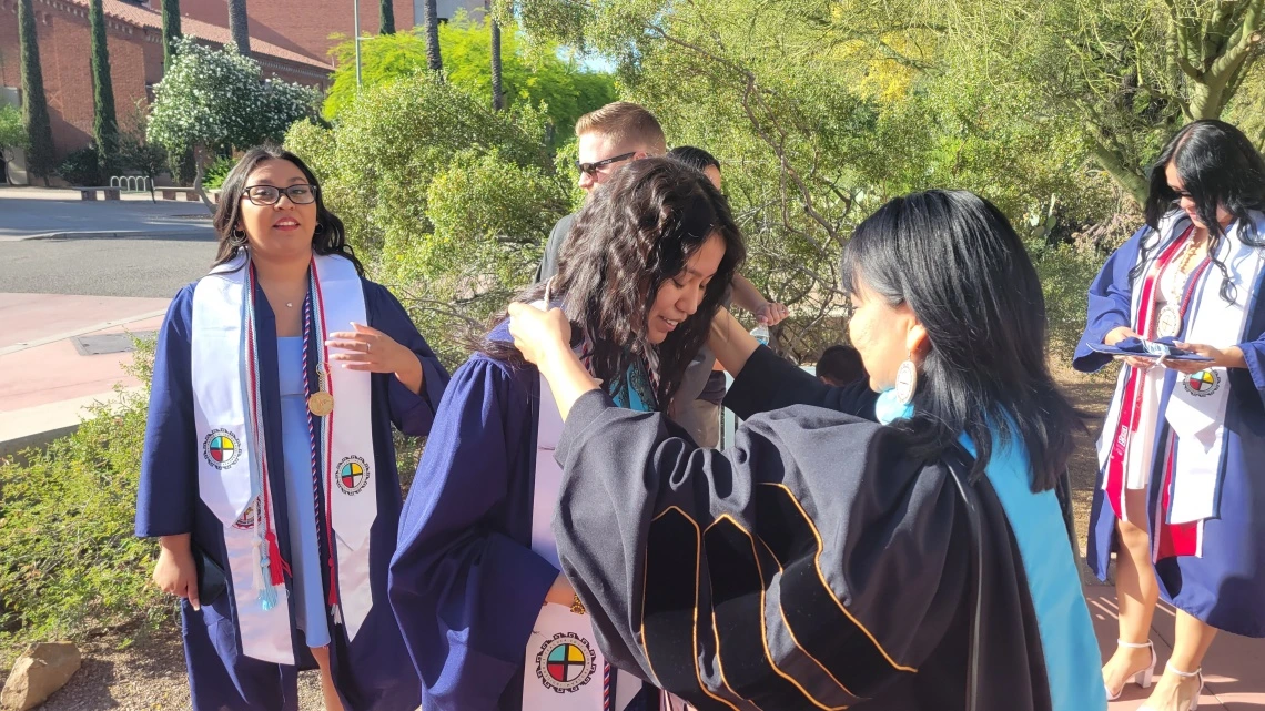 itep students in their graduation garb