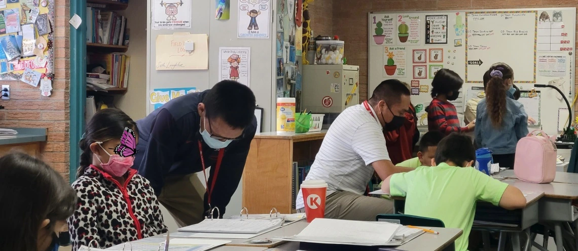Mr. Laughter and Mr. Jones working with their student teaching kiddos. Currently teaching.